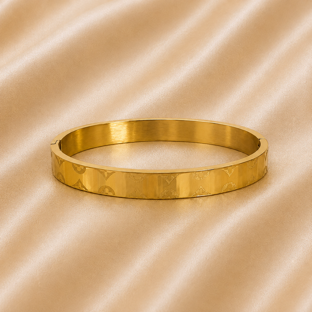Gold designer Rakhi Kada bracelet for brother with engraved pattern